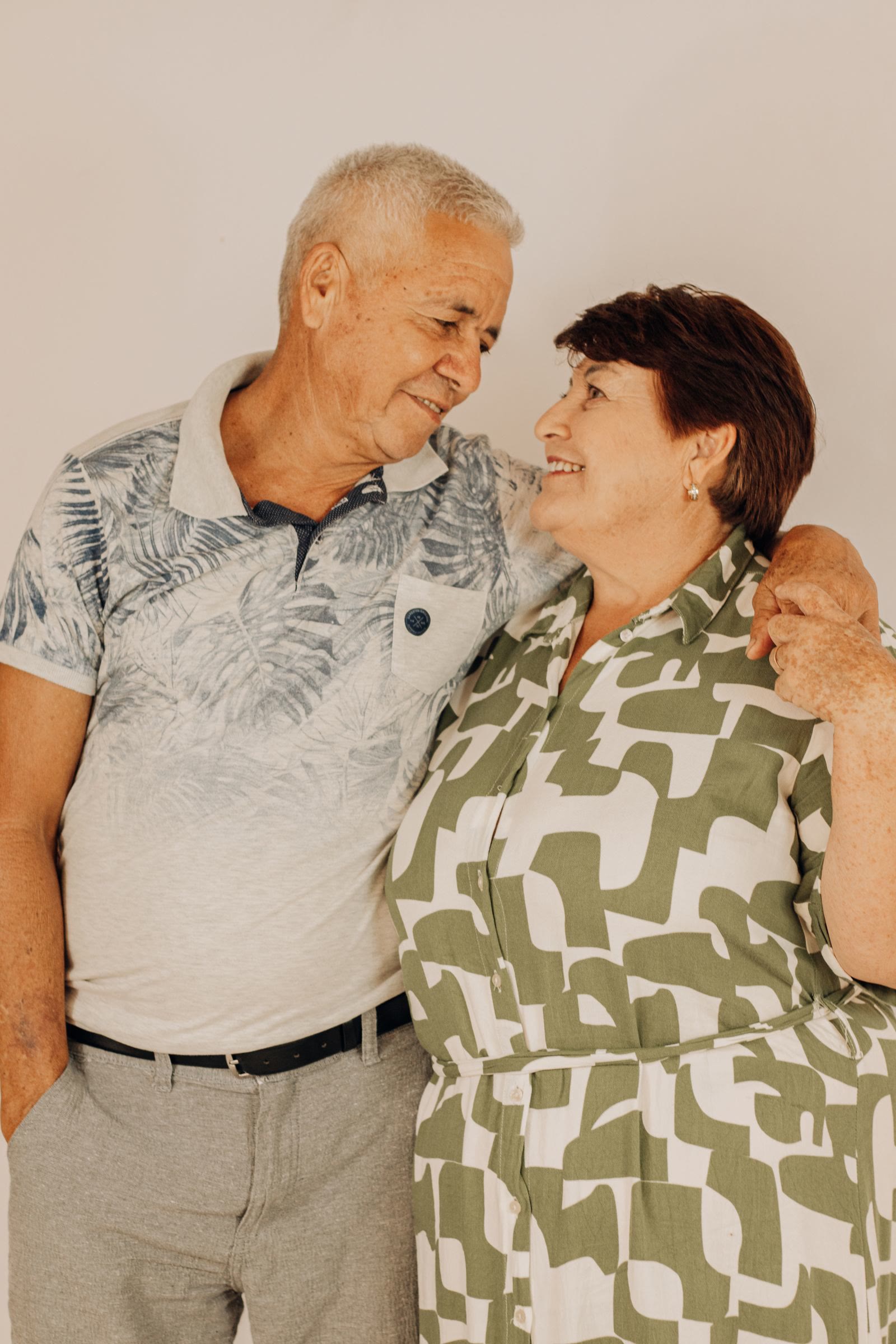 Couple in front of a home
